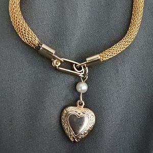 Vintage Sarah Coventry gold tone mesh bracelet with heart charm.
